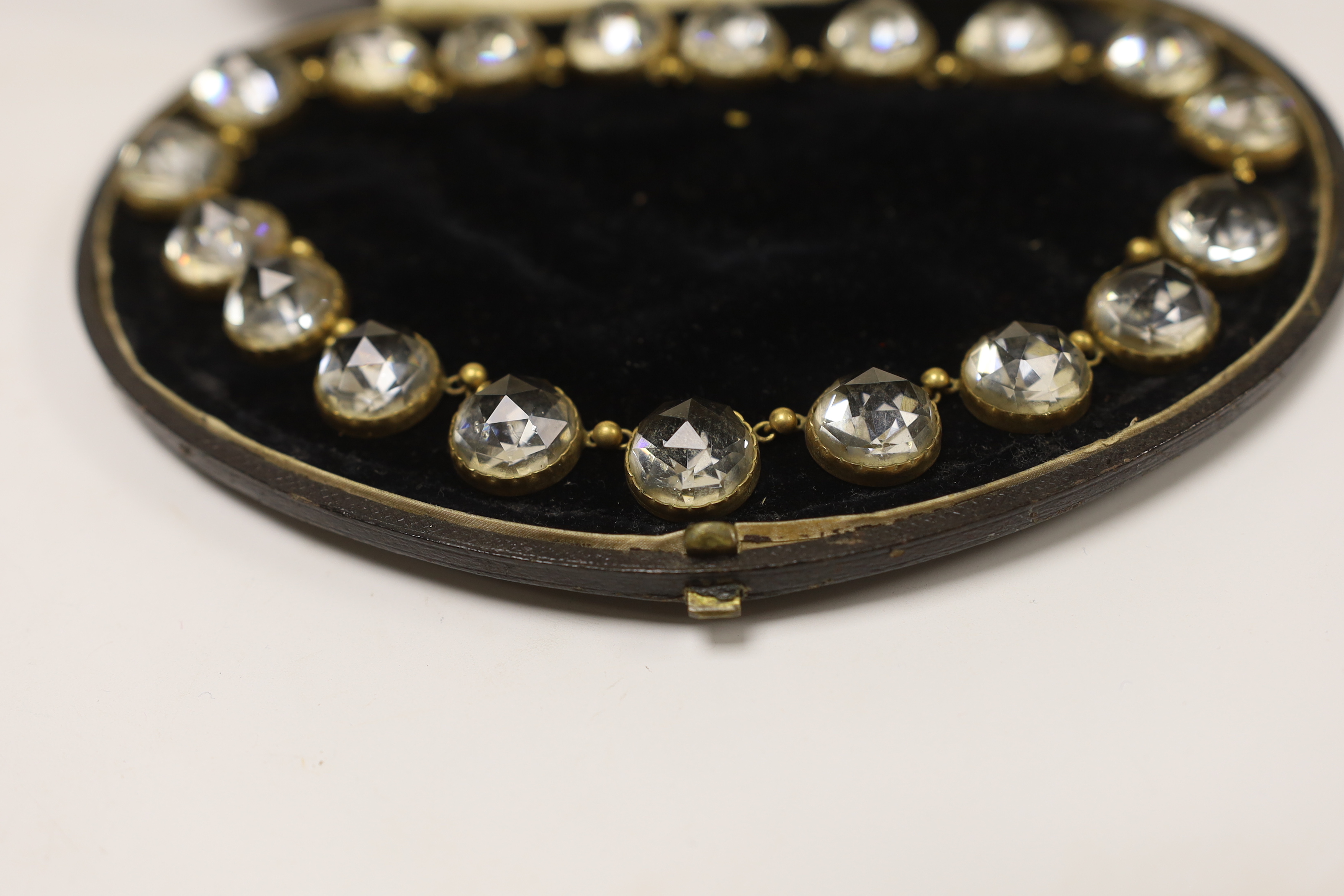 An antique gilt metal and paste set necklace, 44cm.